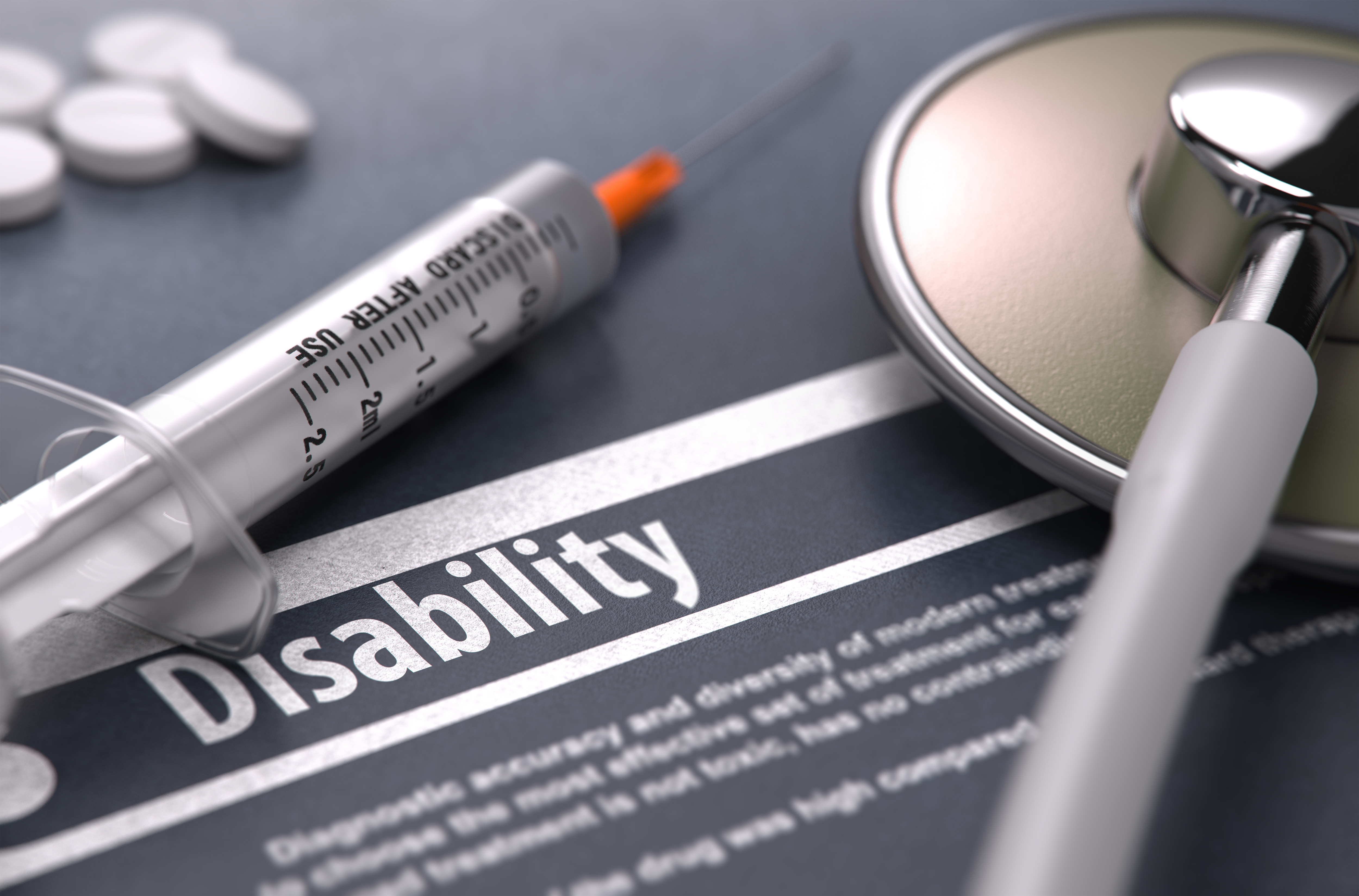 Stethoscope and syringe on disability form